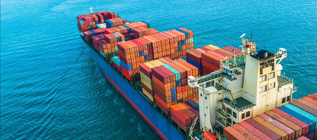 Aerial view of a container vessel loaded with freight containers at sea